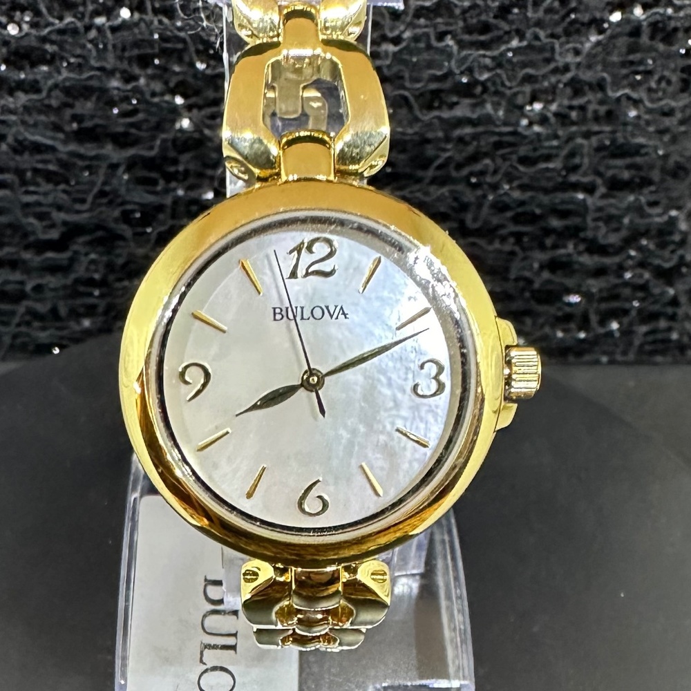 Women's (NWT) Bulova w/Mother-of Pearl Face, Gold Bezel, and Gold Chain Bracelet